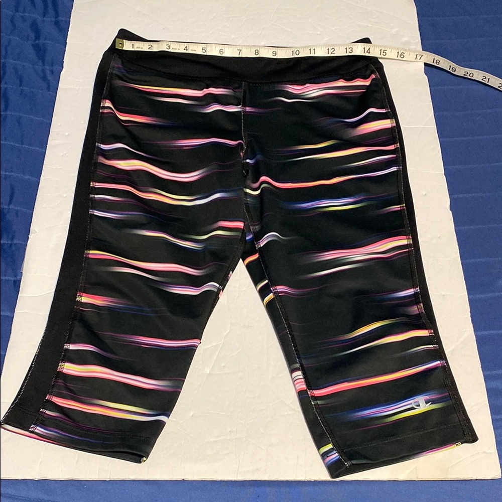 Champion Black, pink, purple, yellow and White striped capri leggings.